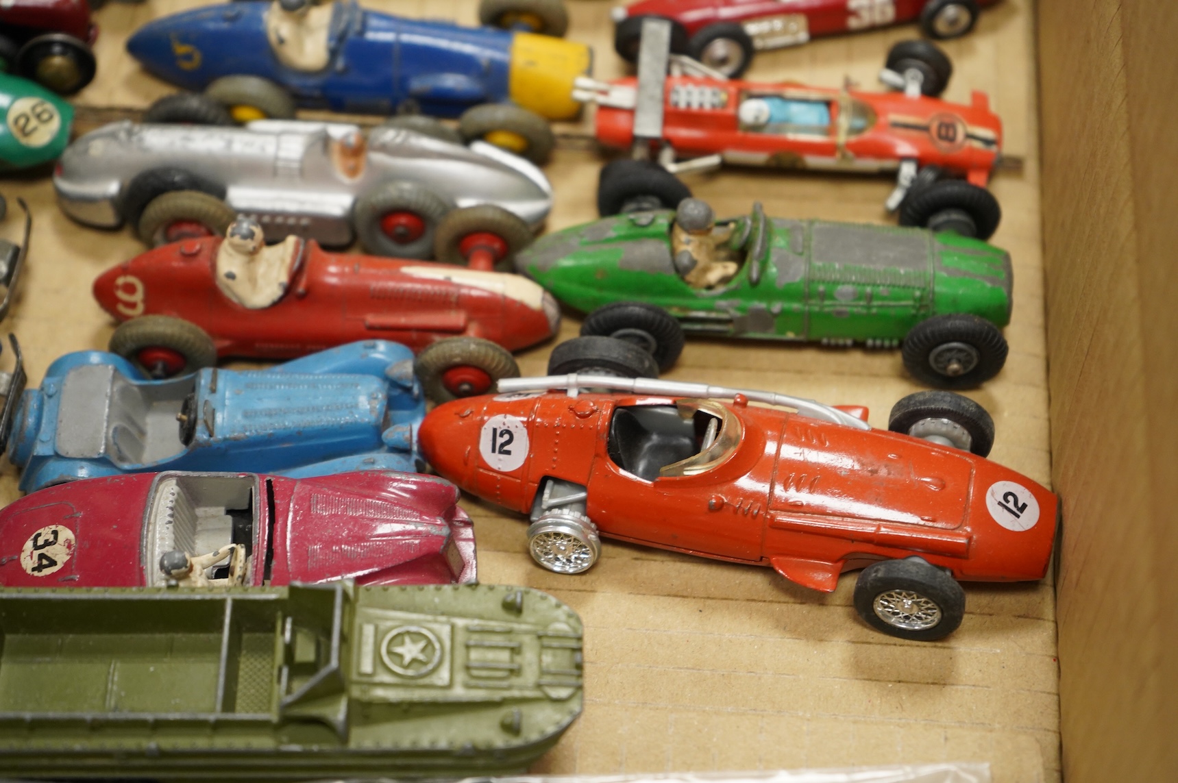 Twenty-eight diecast and tinplate vehicles by Dinky Toys, Schuco, Crescent, Corgi Toys, etc., including a good selection of single seat racing cars, three Schuco telesteering cars, etc.